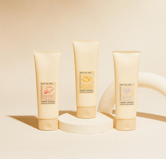 Hand cream set: three pale-yellow tubes with labels for three scents