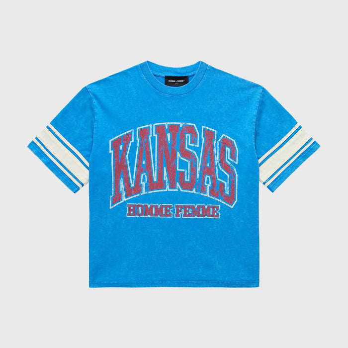 A cropped blue T-shirt featuring varsity stripe sleeves, bold KANSAS print on the chest, Homme Femme logo below, stone washed vintage look, heavyweight cotton, perfect for Spring 2025 collection
