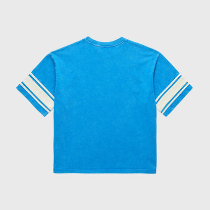 Stone-washed Homme + Femme Kansas cropped blue tee featuring vintage jersey vibe with heavyweight cotton and spring 2025 graphic collection design