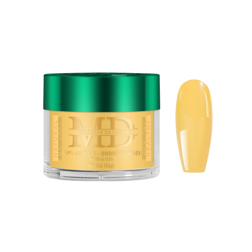 Gold-colored powder in a jar with a green lid, next to a yellow nail color swatch on a white background.