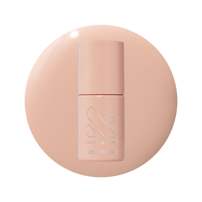 Bottle of KAG - Gel gel polish in neutral peachy pink shade on matching peach background