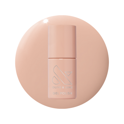 Bottle of KAG - Gel gel polish in neutral peachy pink shade on matching peach background