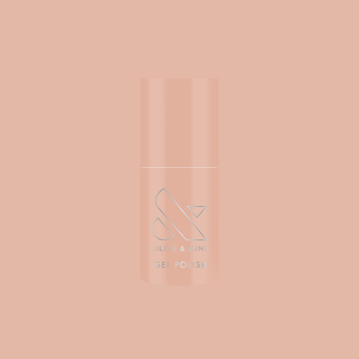 Bottle of KAG - Gel nail polish in neutral peachy pink shade on a matching soft peach background