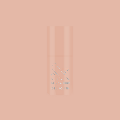 Bottle of KAG - Gel nail polish in neutral peachy pink shade on a matching soft peach background