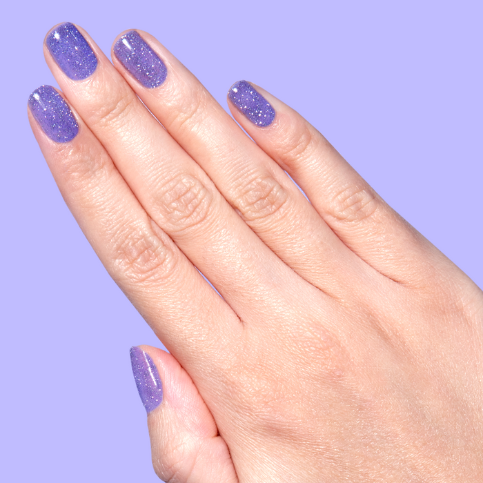 Natural nails with purple flash glitter polish using Karaoke is a Good Time Gel for a sparkling long-lasting mani