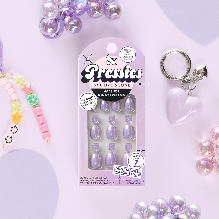 La La Lavender Chrome - Pressies | Extra Short Short | Round showing lavender chrome press on nails in packaging with kids accessories on lilac background