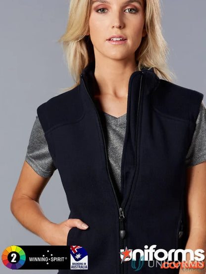 Blonde woman showing Winning Spirit Ladies Micro bonded polar fleece vest with pf10 diamond fleece