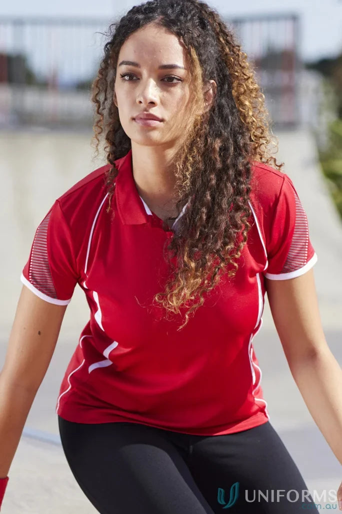 Lady in Biz Collection Ladies Razor Polo with curly hair and black leggings