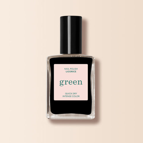 A bottle of Manucurist Licorice nail polish from the Green™ range, featuring a clear rectangular bottle with deep black polish and a black cap, is set against a light beige background.