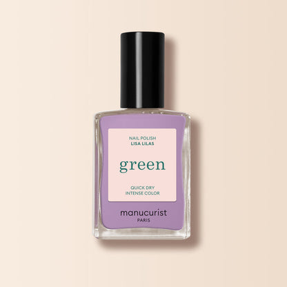 A bottle of Manucurist Lisa Lilas nail polish, featuring a black cap and lavender purple shade, from the Green™ range, set against a light beige background.