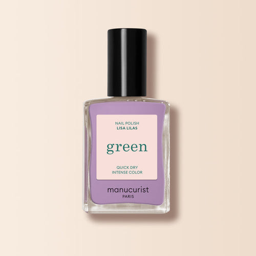 A bottle of Manucurist Lisa Lilas nail polish, featuring a black cap and lavender purple shade, from the Green™ range, set against a light beige background.