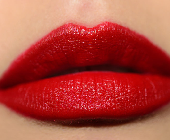 M.A.C beauty product featuring Teyana Taylor, two shades of lipstick in a vibrant pink and nude color, with lips and makeup swatch.