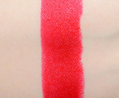 MAC x Teyana Taylor beauty product featuring two shades of NWOB lipstick with swatches on skin, showcasing vibrant colors and texture.