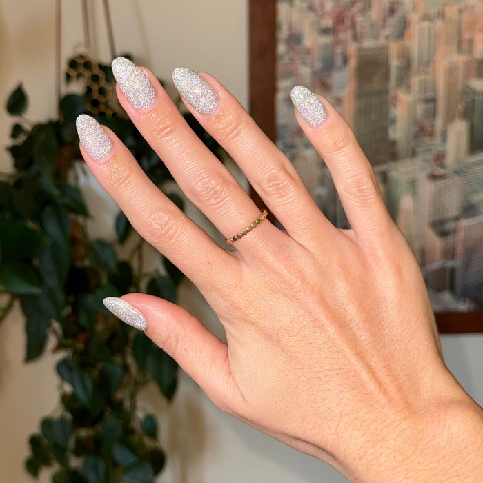 Mani on the Dance Floor Gel glitter polish on nails showing sparkling silver manicure for long-lasting wear