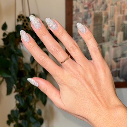 Mani on the Dance Floor Gel glitter polish on nails showing sparkling silver manicure for long-lasting wear