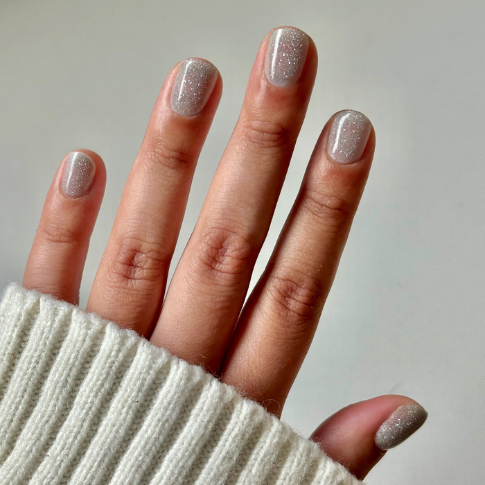 Mani on the Dance Floor Gel on natural nails showing subtle silver sparkle gel polish for a long-lasting manicure