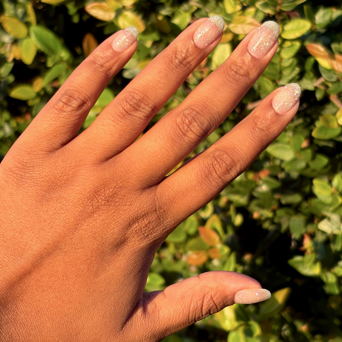 Mani on the Dance Floor Gel on natural nails showing glittery silver gel polish for a sparkling long-lasting manicure