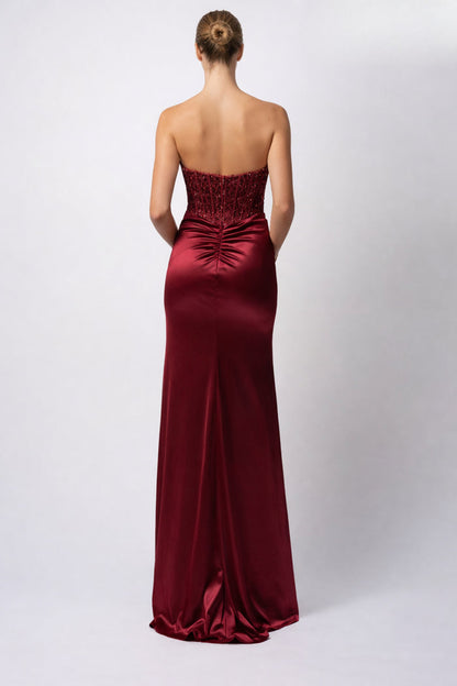 Strapless wine satin evening gown with boned bodice