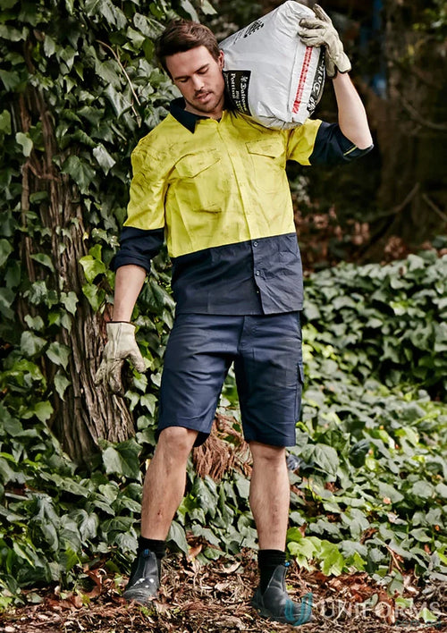 Man carrying soil in syzmik mens rugged cooling vented shorts zs505 vented