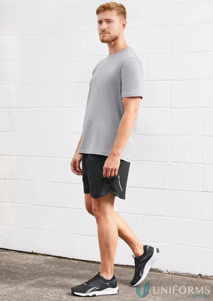 Man in athletic wear wearing Mens Tactic Shorts with mesh panels and st511m design