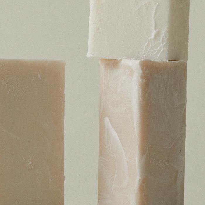 Mini soap bar with embossed leaf texture on two stacked bars
