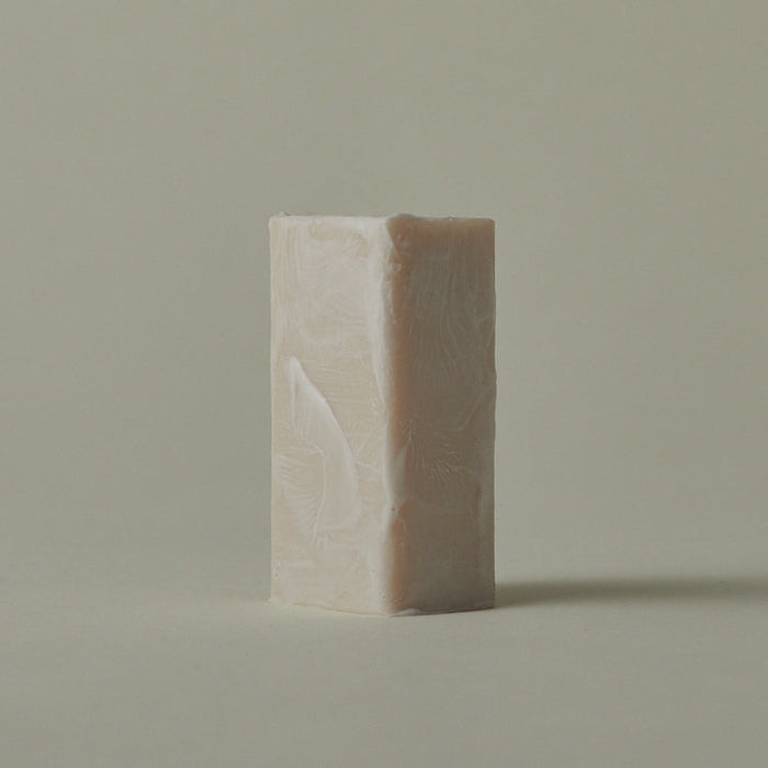 Mini soap bar with embossed leaf pattern, light front and darker back