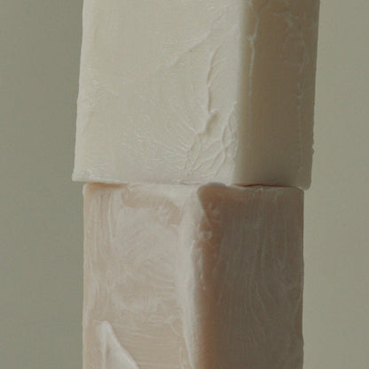 Mini soap bar close-up with embossed leaf texture on two stacked bars
