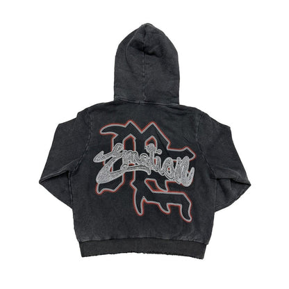 Close-up of the Mixed Emotion Cupid design with rhinestones on the acid wash black hoodie
