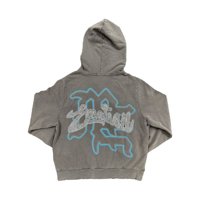 Close-up of the grey Rhinestone Cupid design on the zip-up hoodie with intricate detailing