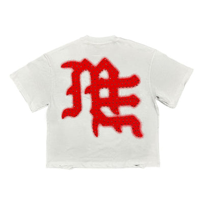 Close-up of the Red End rhinestone detail on the white fabric of the mixed emotion tee shirt showcasing vibrant colors and sparkling embellishments