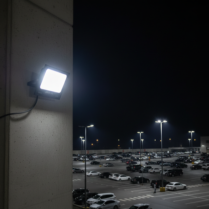 Neelux 100W LED flood light illuminating large outdoor area at night