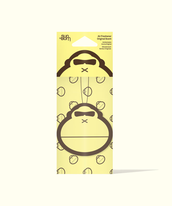 Sun Bum Original Scent Air Freshener with gorilla face design hanging on yellow packaging background.