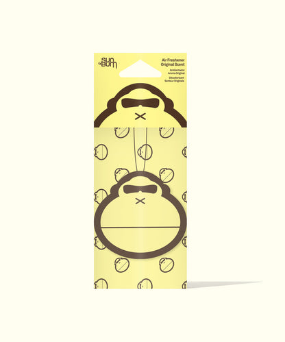Sun Bum Original Scent Air Freshener with gorilla face design hanging on yellow packaging background.