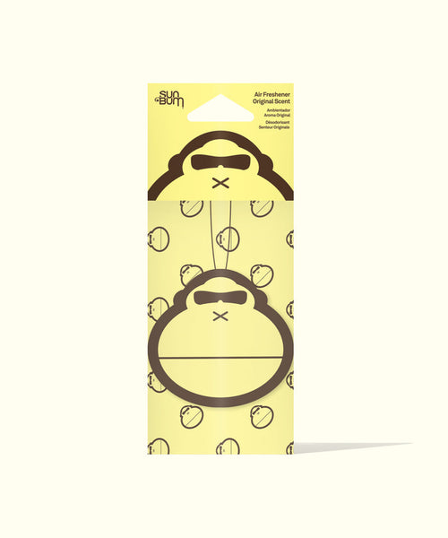 Sun Bum Original Scent Air Freshener with gorilla face design hanging on yellow packaging background.