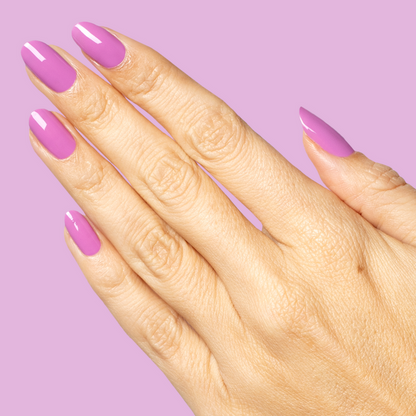 Hand with glossy nails painted in bright floral purple shade using Petal - Gel on matching purple background