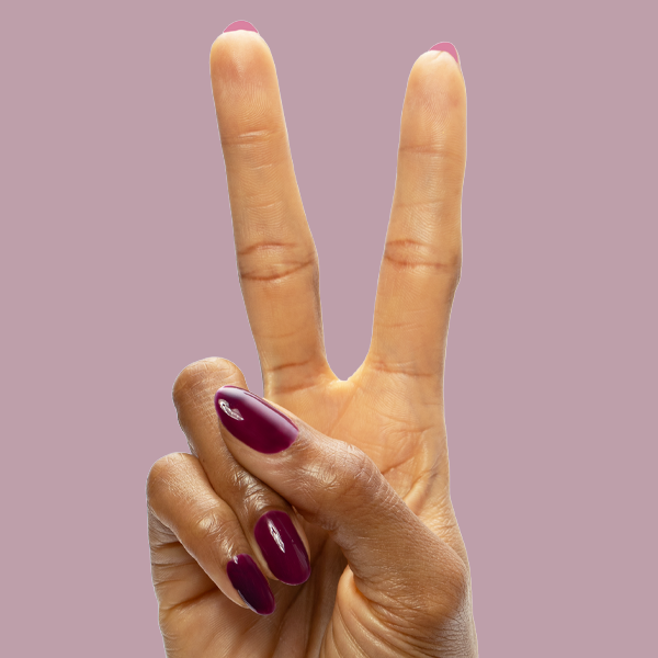 Plaza - Gel polish on nails in rich mulberry purple for a sleek, long-lasting manicure by Olive and June