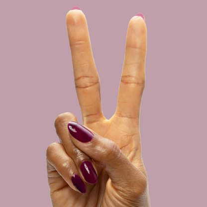 Plaza - Gel polish on nails in rich mulberry purple for a sleek, long-lasting manicure by Olive and June