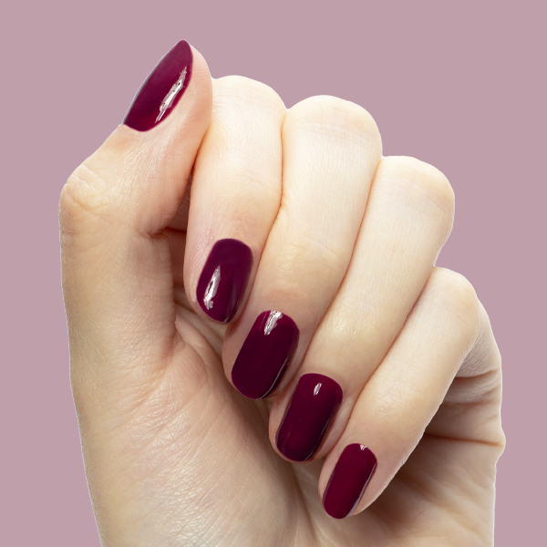 Plaza - Gel polished nails in deep mulberry purple for a glossy, long-lasting manicure by Olive and June
