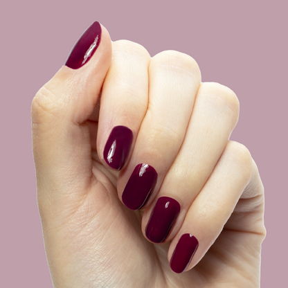 Plaza - Gel polished nails in deep mulberry purple for a glossy, long-lasting manicure by Olive and June