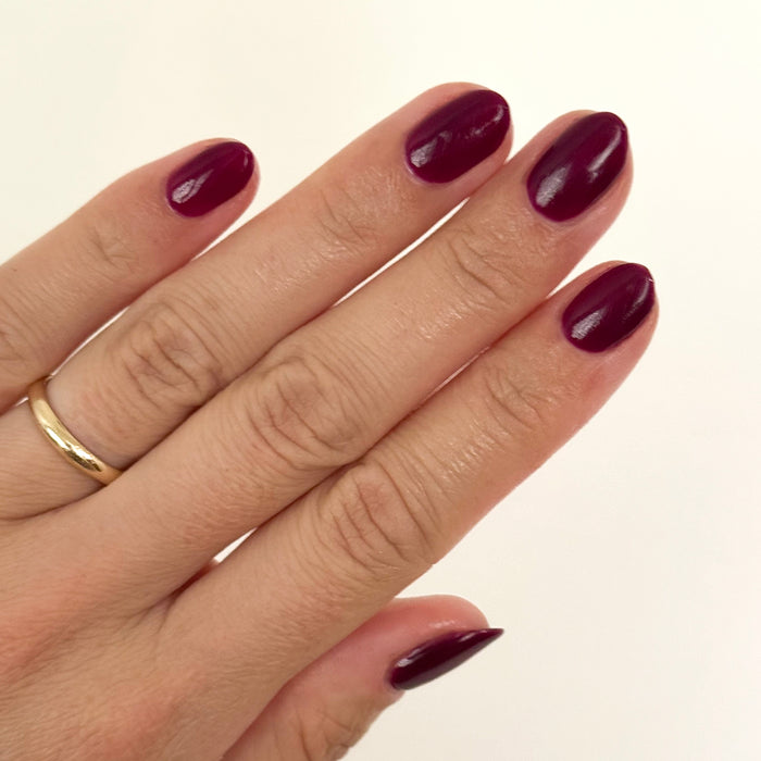 Plaza - Gel polished nails in deep mulberry purple with a glossy finish for a long-lasting manicure by Olive and June