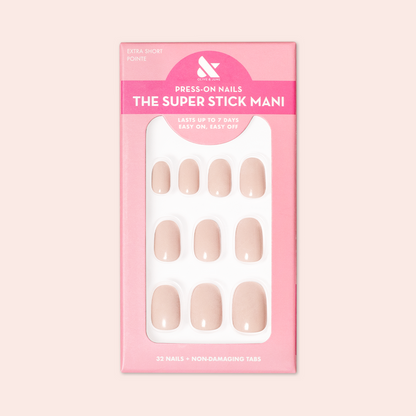 Pointe | Extra Short | Round - Tab Press-On soft ballerina pink press-on nails neatly arranged in pink packaging