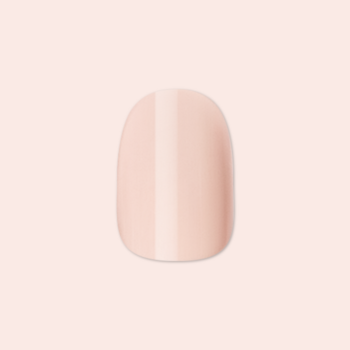 Pointe | Extra Short | Round - Tab Press-On soft ballerina pink false nail with smooth glossy finish on pale background
