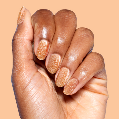 Pop Fizz Mani Gel applied on natural nails showing sparkling yellow gold glitter polish for at-home manicure use