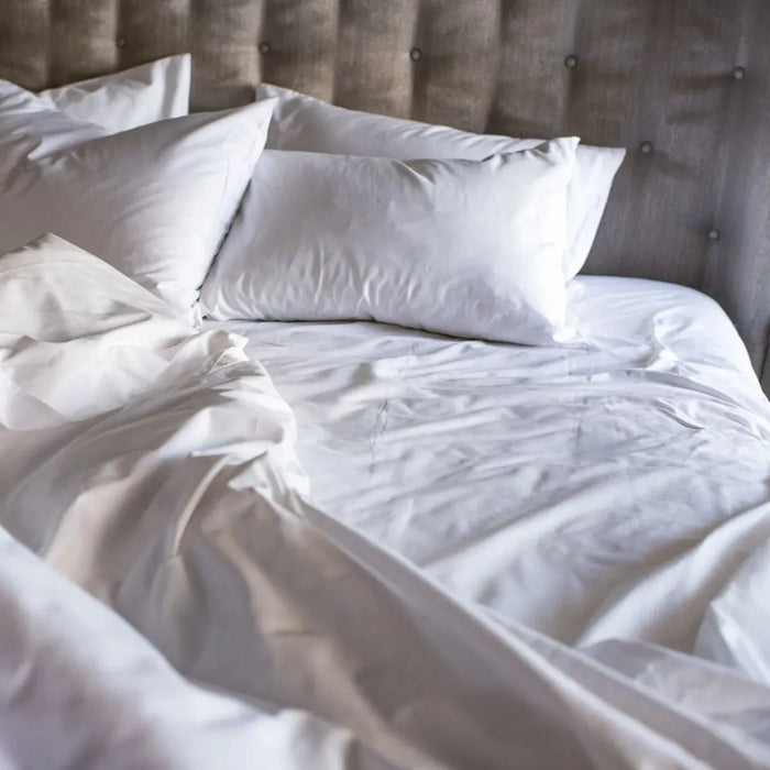 Close-up of crisp percale weave bed sheets - breathable T-300 blend construction