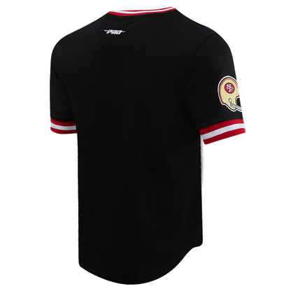 Close-up of the retro San Francisco 49ers logo on black and red tee fabric