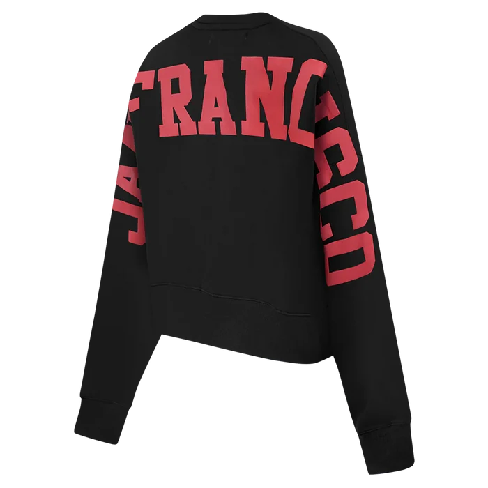 Side angle of the black Wingspan Women's Crewneck showing comfortable fit and team branding details