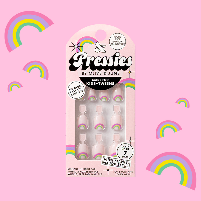 Rainbow Connection - Pressies | Extra Short Short | Round showing pastel pink press on nails with rainbow details in packaging on pink background