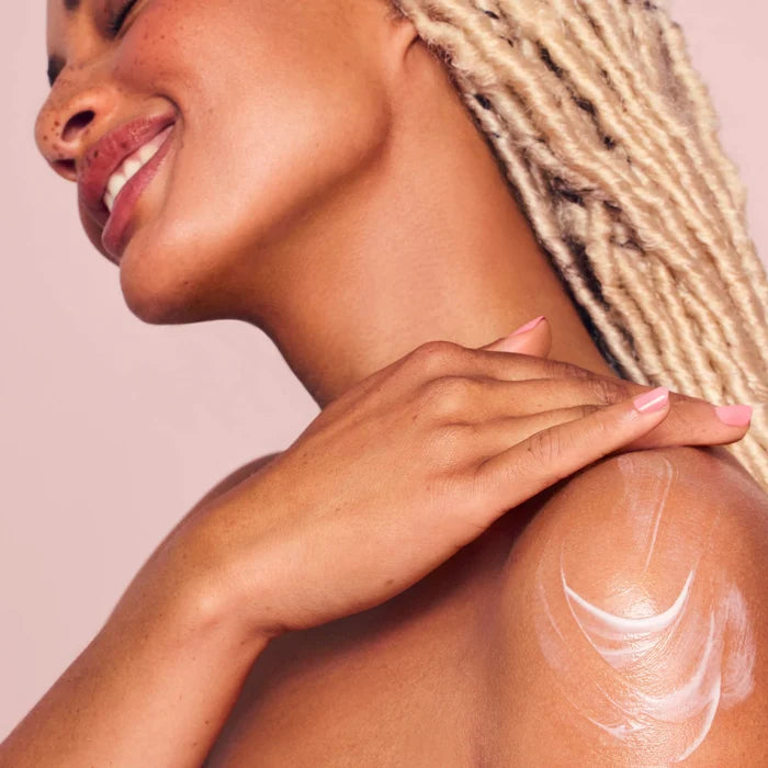 Rare Beauty Find Comfort Niacinamide Hydrating Body Lotion in 850ml bottle, featuring a sleek design and nourishing skincare formula.