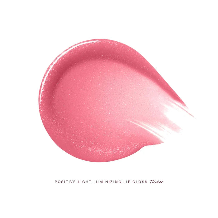 Rare Beauty Positive Light Luminizing Lip Gloss in various shades, featuring shiny, smooth gloss finish, NWOB, close-up of tubes.