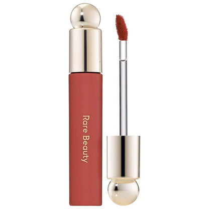 Rare Beauty Soft Pinch Tinted Lip Oil Stain in multiple shades, featuring a sleek tube and applicator, new in box.